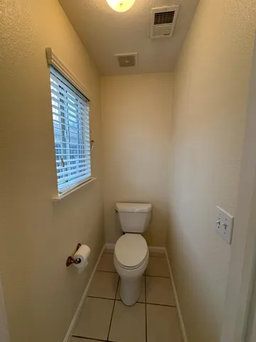 a spacious bathroom with a large tub and shower