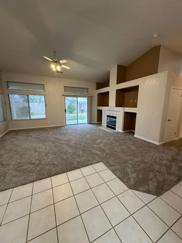 a kitchen with stainless steel appliances a sink a stove a microwave a sink a refrigerator and cabinets