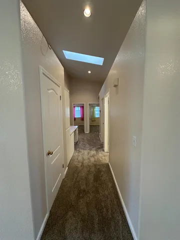 a bathroom with a sink mirror vanity and toilet