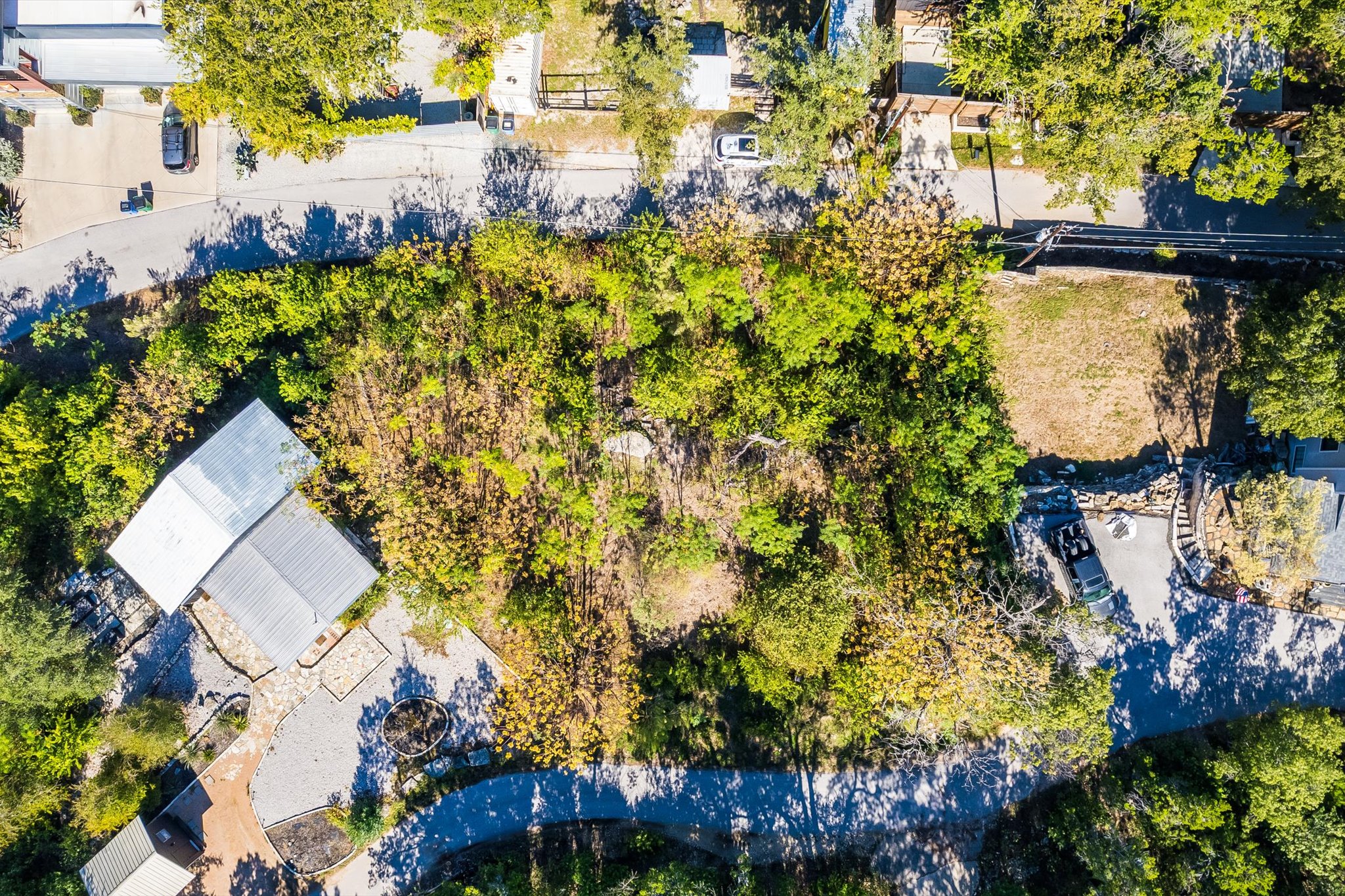 an aerial view of a house with a yard and garden