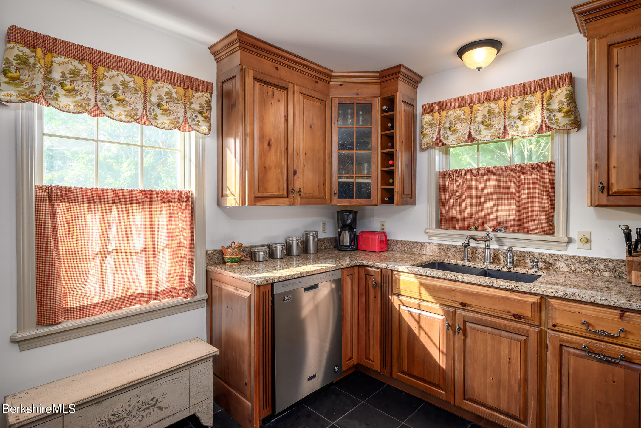 69 County Road Pownal, VT 05261 - Photo 12 of 33 a kitchen with a sink wooden cabinets and a window