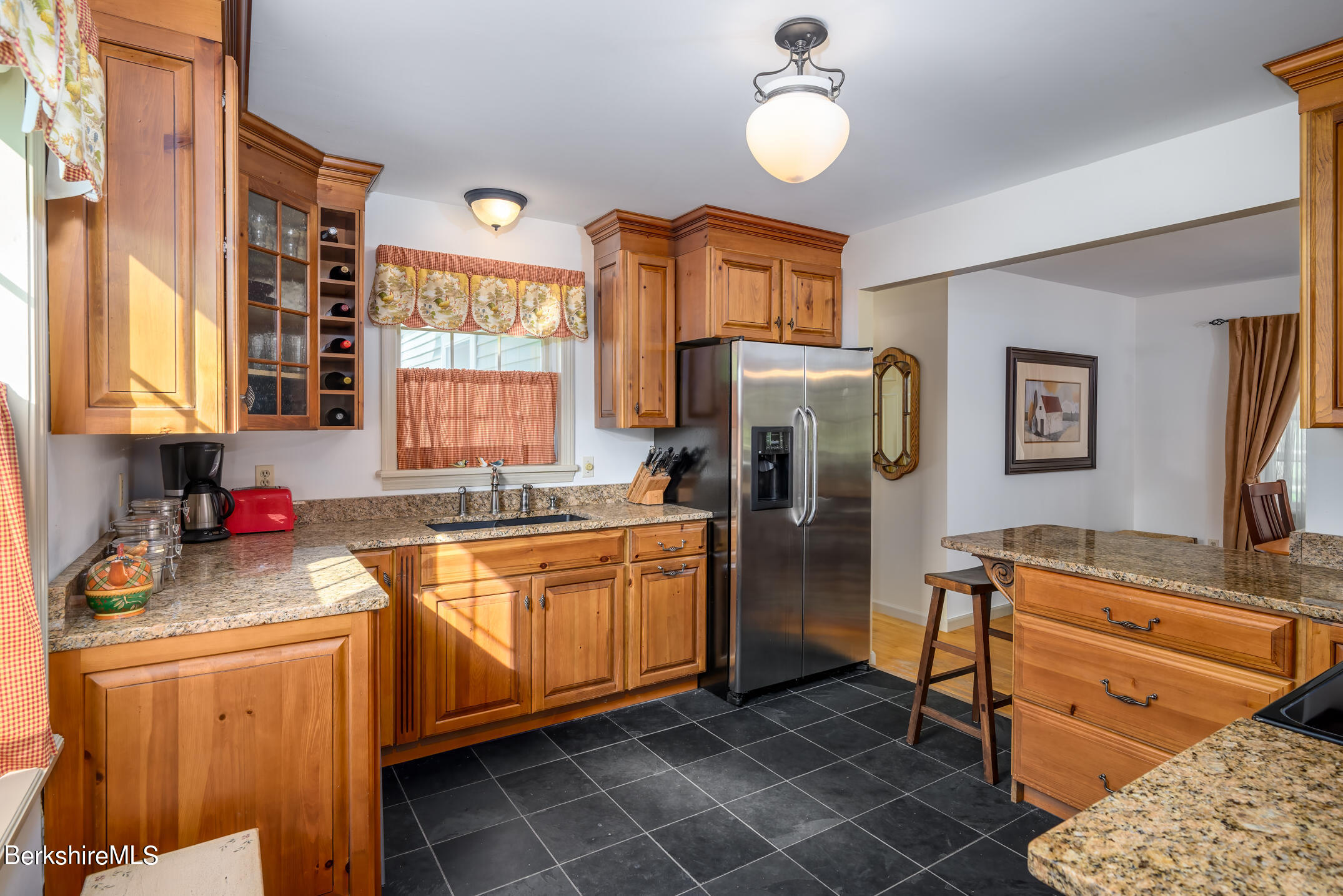 69 County Road Pownal, VT 05261 - Photo 13 of 33 a kitchen with stainless steel appliances granite countertop a refrigerator and a stove top oven