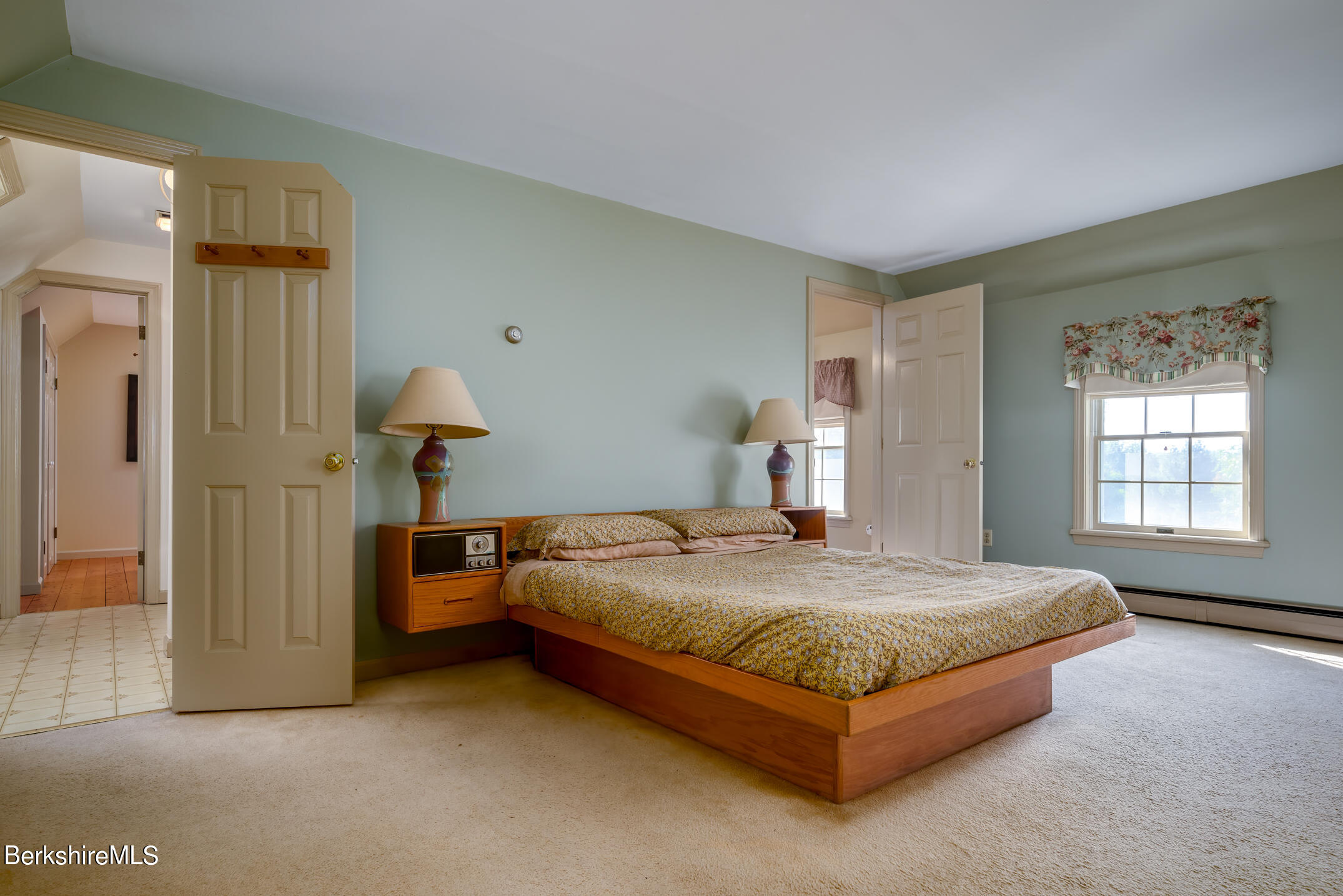 69 County Road Pownal, VT 05261 - Photo 26 of 33 a bed sitting in a spacious bedroom next to a window and a larger closet