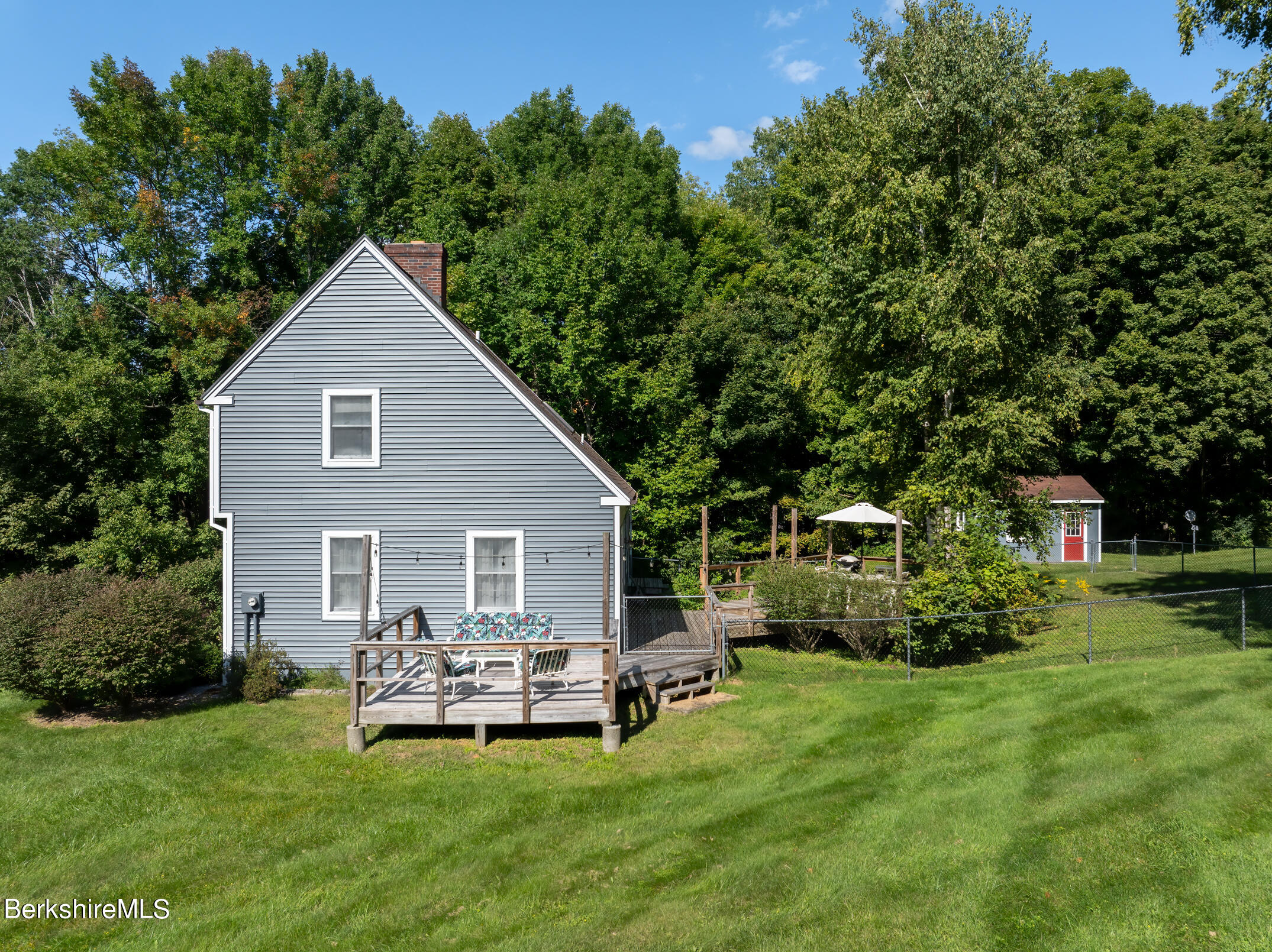 69 County Road Pownal, VT 05261 - Photo 5 of 33 a view of a house with a yard and sitting area