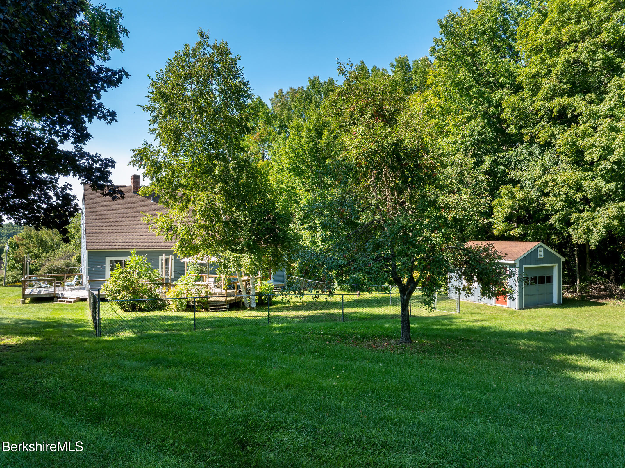 69 County Road Pownal, VT 05261 - Photo 7 of 33 a front view of a house with a yard table and trees