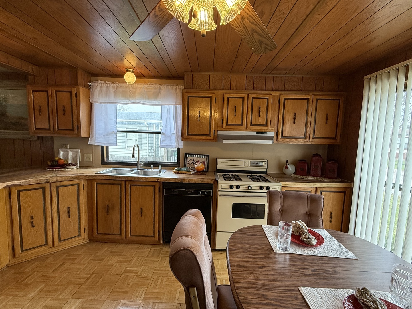 608 Tanglewood Road Matteson, IL 60443 - Photo 2 of 28 a kitchen with stainless steel appliances granite countertop a stove a sink dishwasher and cabinets with wooden floor