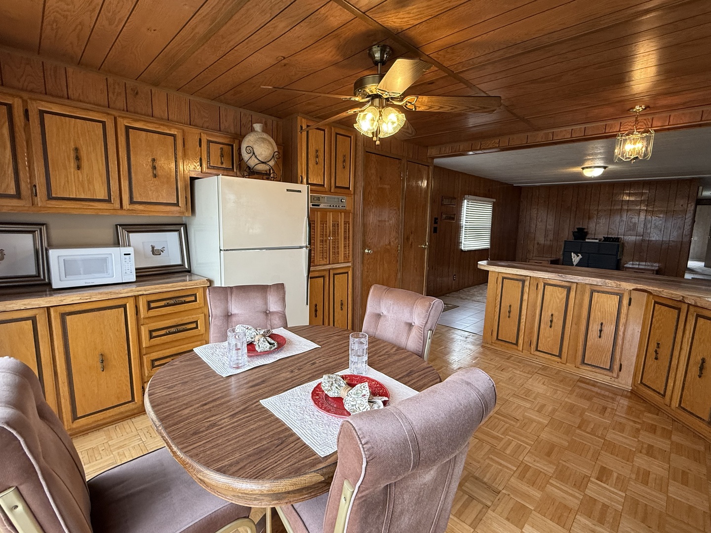 608 Tanglewood Road Matteson, IL 60443 - Photo 5 of 28 a living room with stainless steel appliances furniture a rug and a kitchen view