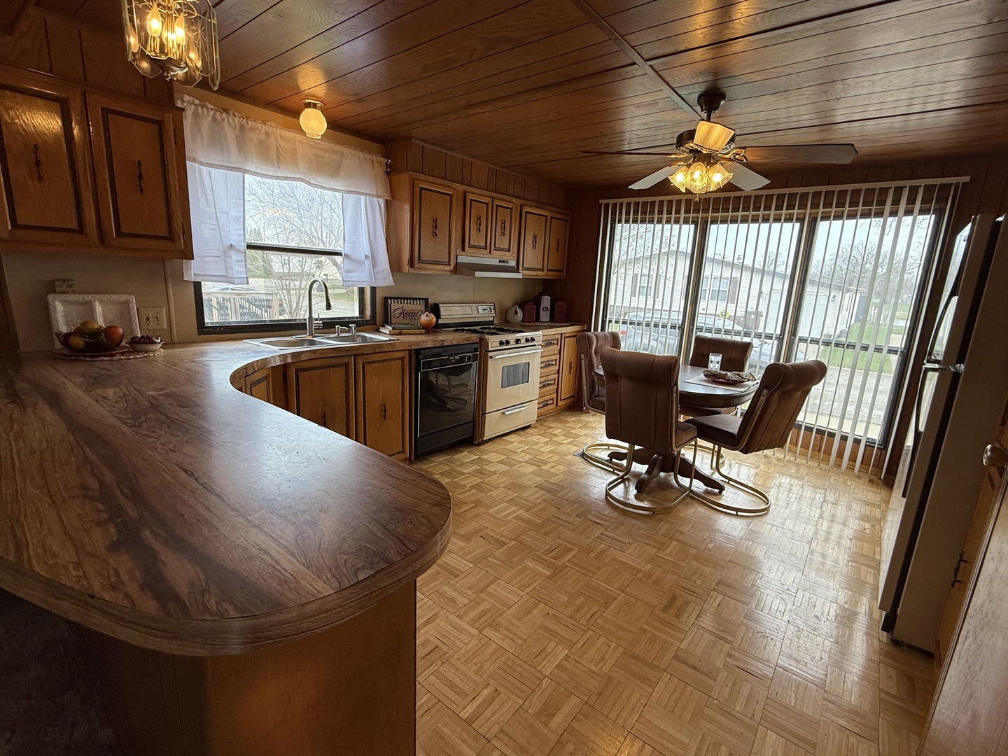 608 Tanglewood Road Matteson, IL 60443 - Photo 6 of 28 a kitchen with stainless steel appliances granite countertop a sink a stove and a wooden cabinets