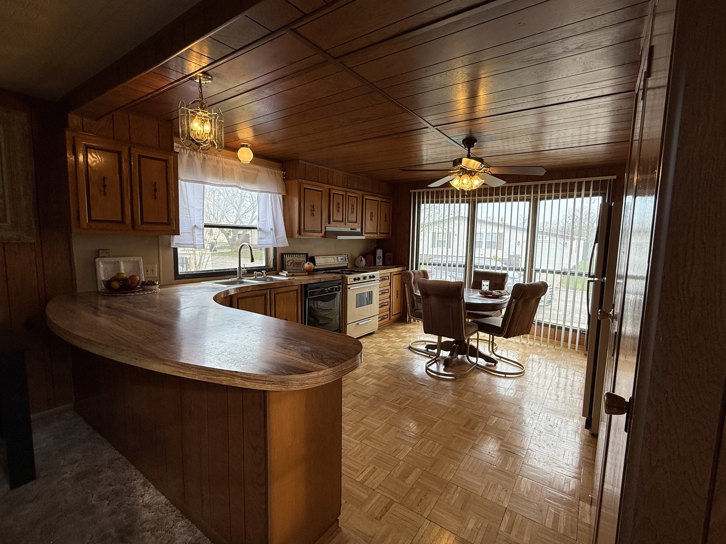 608 Tanglewood Road Matteson, IL 60443 - Photo 9 of 28 a kitchen with counter top space cabinets and outdoor seating