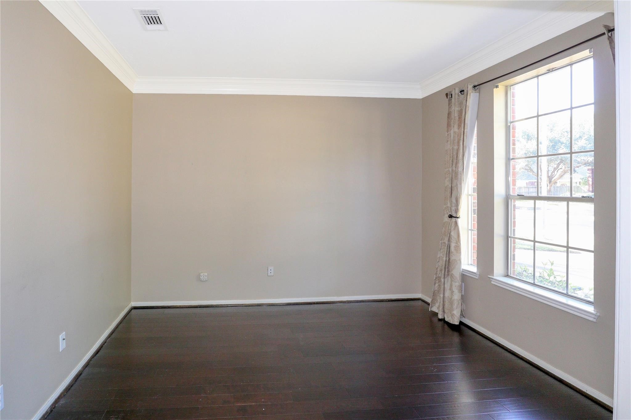 23207 Olive Ridge Court Katy, TX 77494 - Photo 12 of 45 wooden floor in an empty room with a window