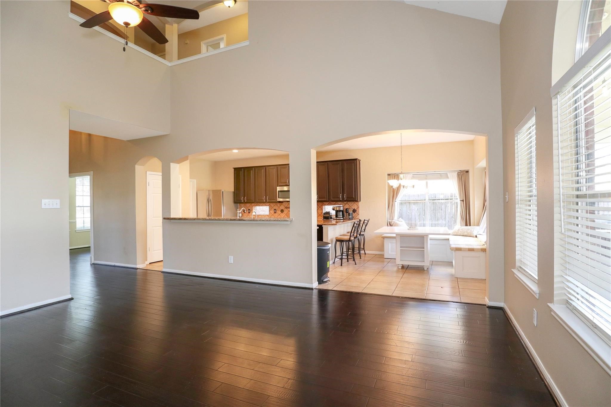 23207 Olive Ridge Court Katy, TX 77494 - Photo 19 of 45 a view of a livingroom with furniture wooden floor and a large window
