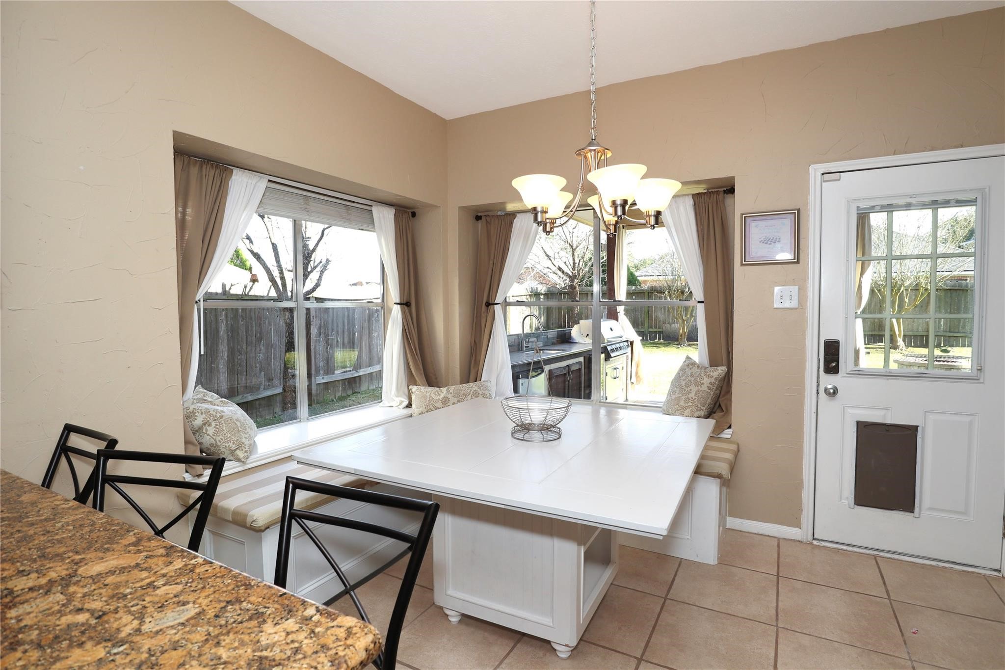 23207 Olive Ridge Court Katy, TX 77494 - Photo 25 of 45 a view of a dining room with furniture wooden floor and chandelier