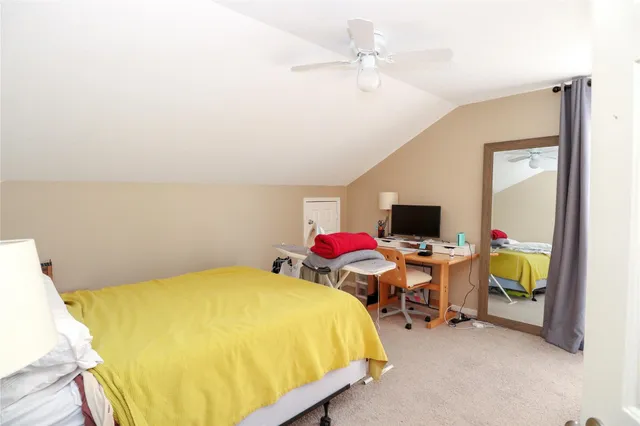 a bathroom with a sink vanity and mirror