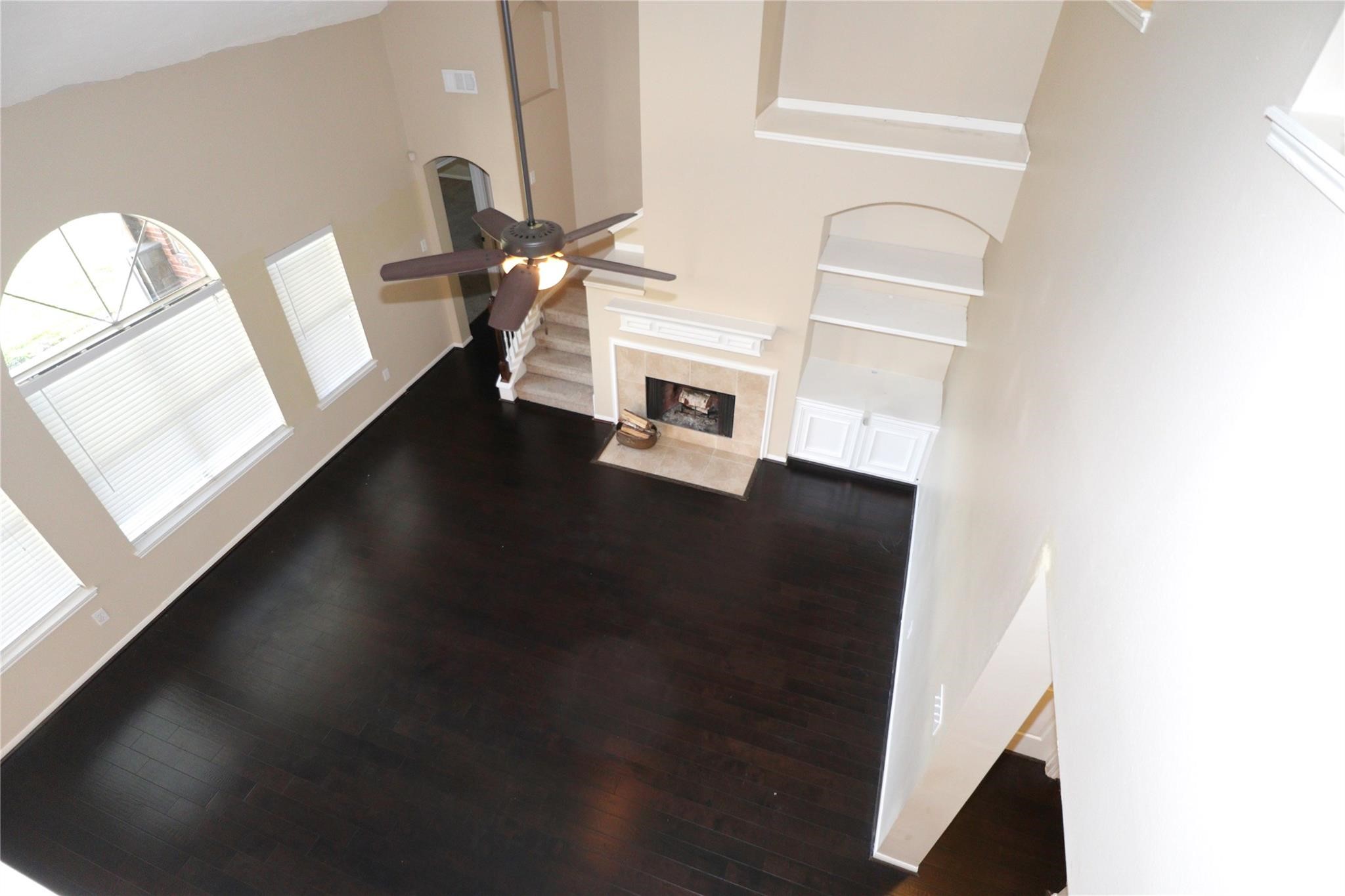 23207 Olive Ridge Court Katy, TX 77494 - Photo 38 of 45 a view of a livingroom with wooden floor and staircase
