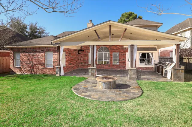 a view of a house with a yard porch and sitting area