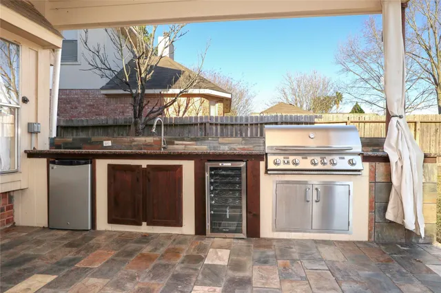 a view of a hallway with wooden floor and windows