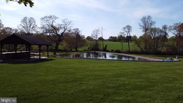 28814 Kemptown Road Damascus, MD 20872 - Photo 44 of 49 a view of a swimming pool with a yard