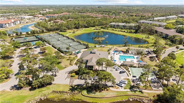 an aerial view of residential building and trees