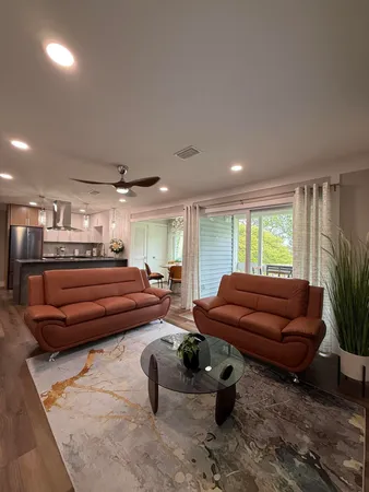 a bedroom with furniture and a window