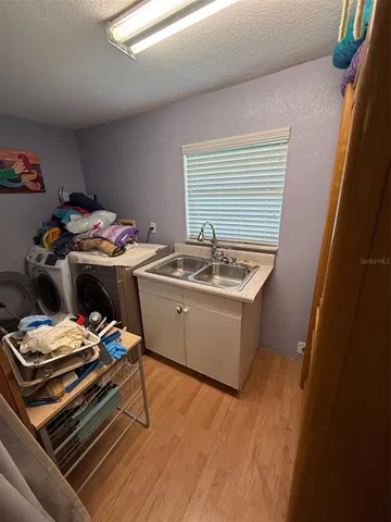 a utility room with dryer and washer