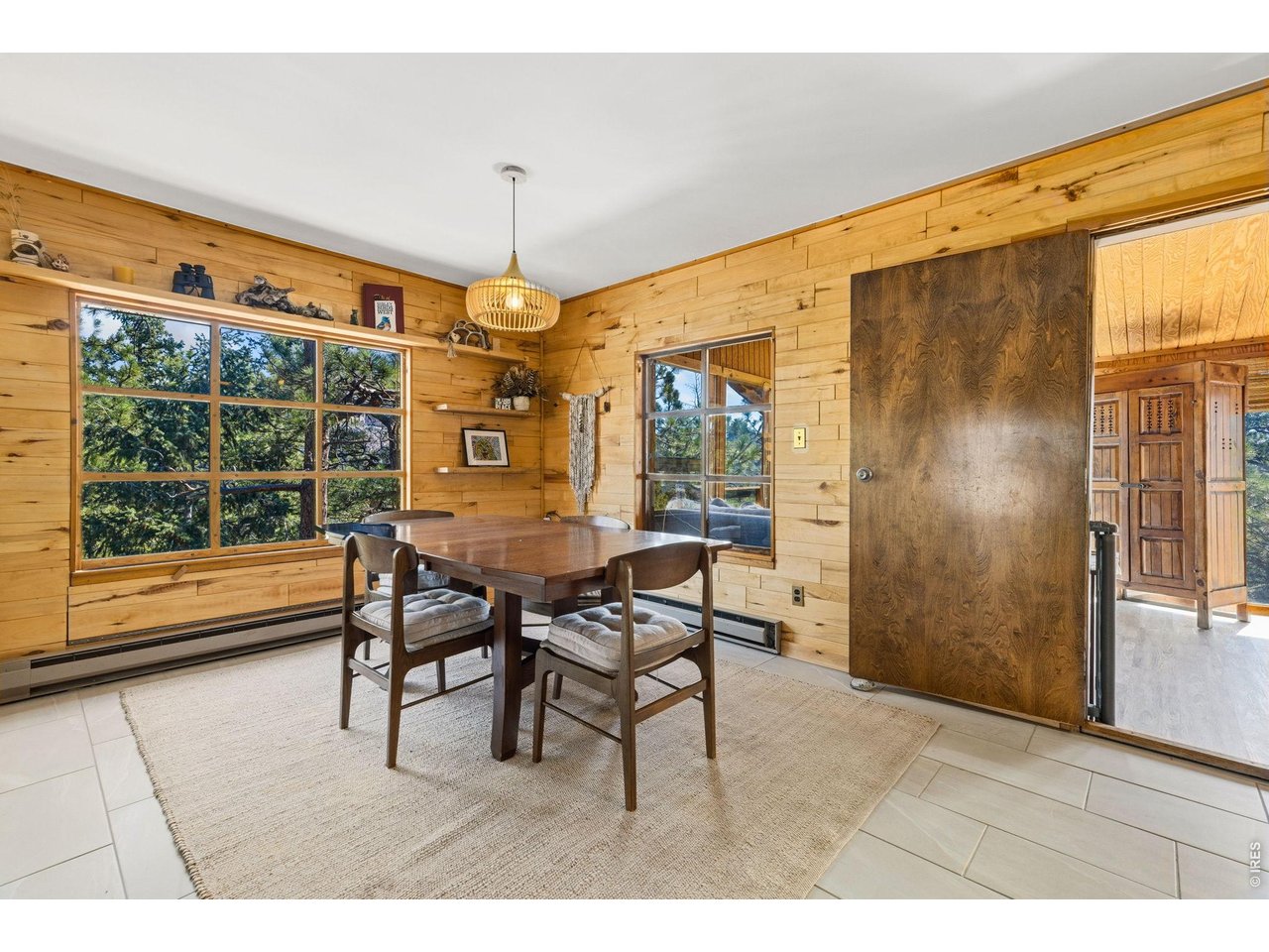 128 Elk Road Lyons, CO 80540 - Photo 9 of 50 Dining room with entry to the sunroom