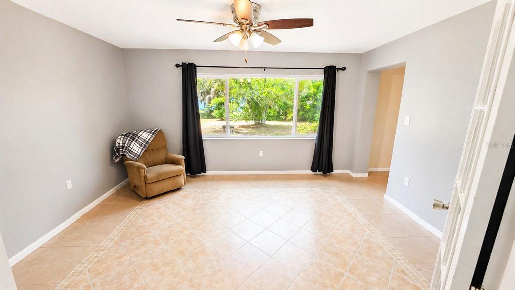 2 Clear Place Ocala, FL 34472 - Photo 14 of 23 an empty room with windows and ceiling fan
