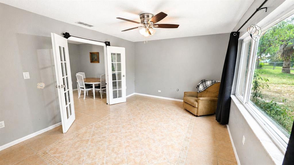 2 Clear Place Ocala, FL 34472 - Photo 15 of 23 a view of a livingroom with furniture and a ceiling fan