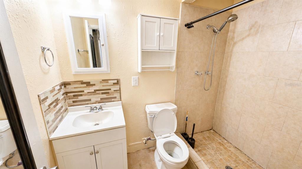 2 Clear Place Ocala, FL 34472 - Photo 20 of 23 a white toilet sitting next to a bathroom sink