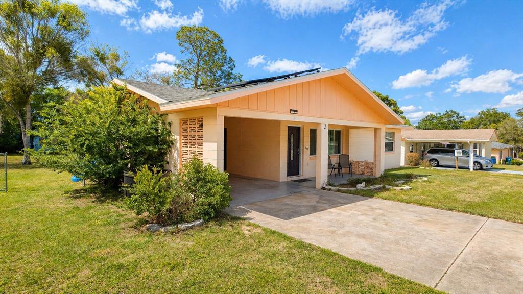 2 Clear Place Ocala, FL 34472 - Photo 3 of 23 a front view of a house with garden