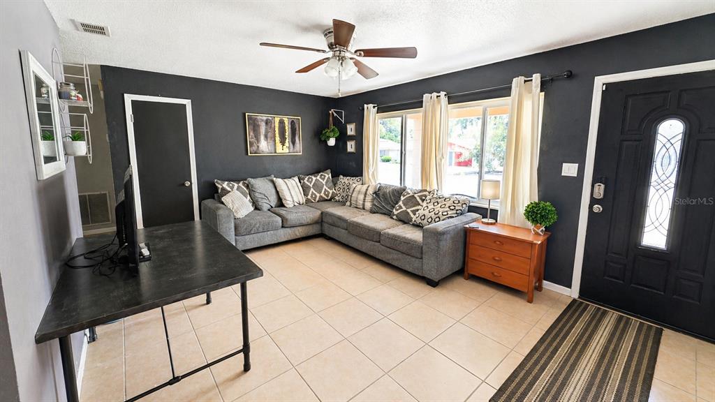 2 Clear Place Ocala, FL 34472 - Photo 9 of 23 a living room with furniture and a large window