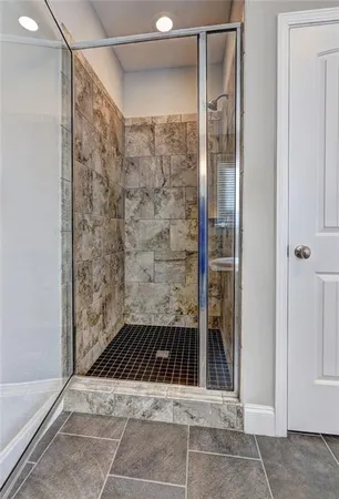 a bathroom with a sink and a shower