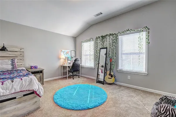 a room with gym equipment and a window