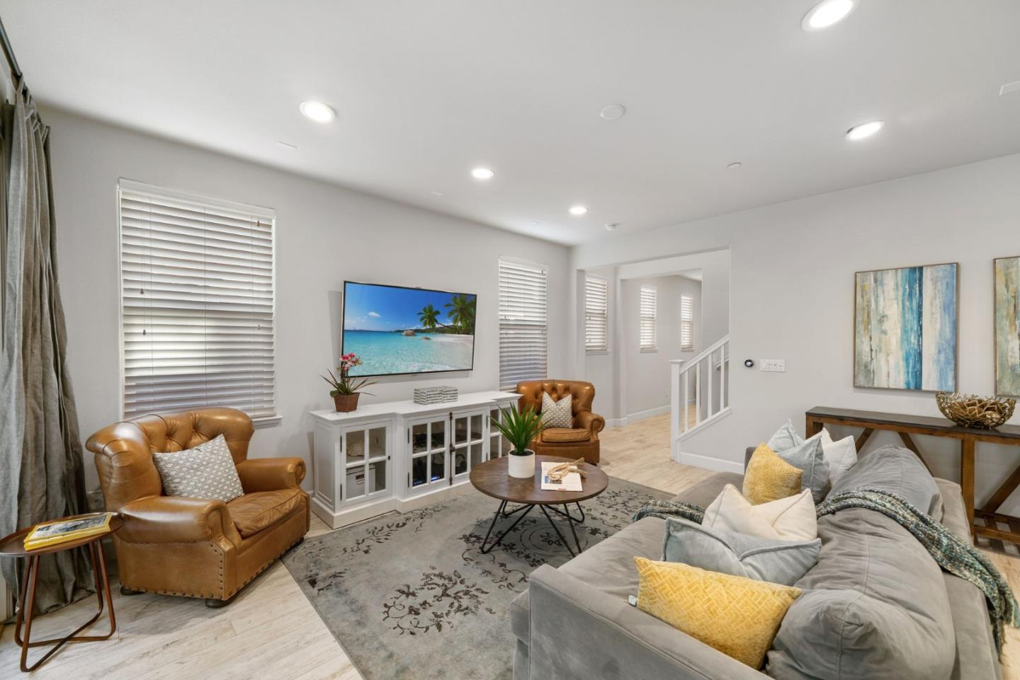 11958 Glaskin Place Dublin, CA 94568 - Photo 14 of 41 a living room with furniture and a flat screen tv