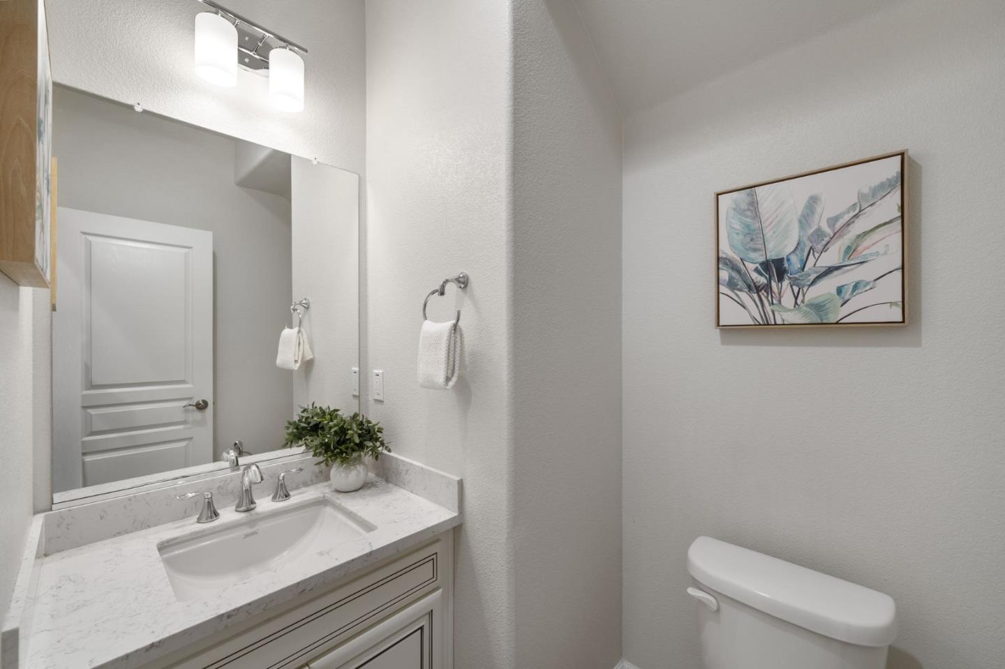11958 Glaskin Place Dublin, CA 94568 - Photo 15 of 41 a bathroom with a sink a toilet and mirror