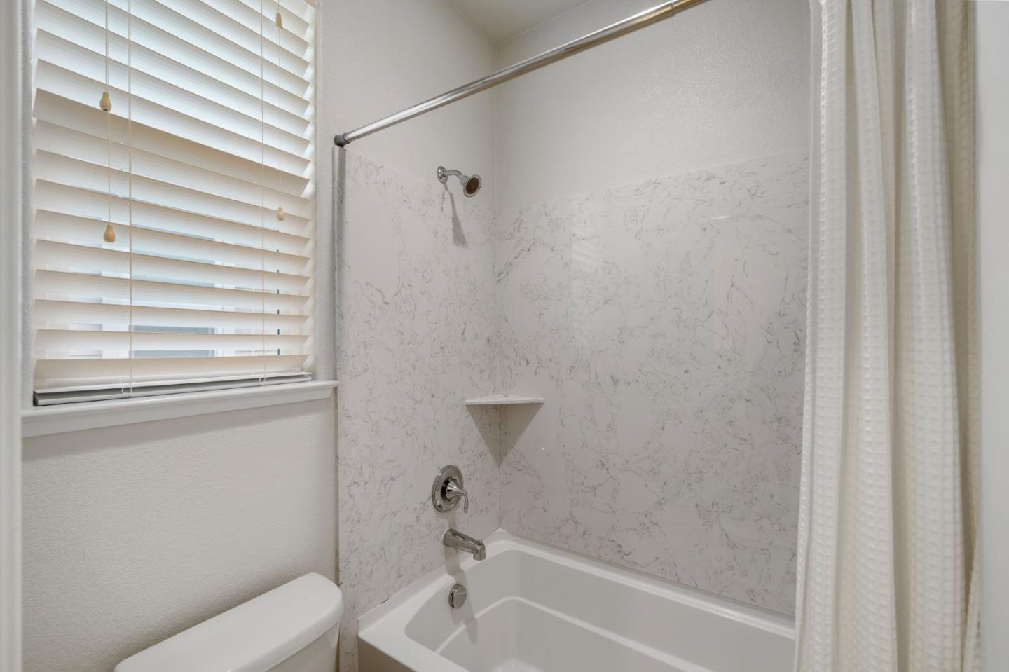 11958 Glaskin Place Dublin, CA 94568 - Photo 25 of 41 a bathroom with a toilet and a bathtub