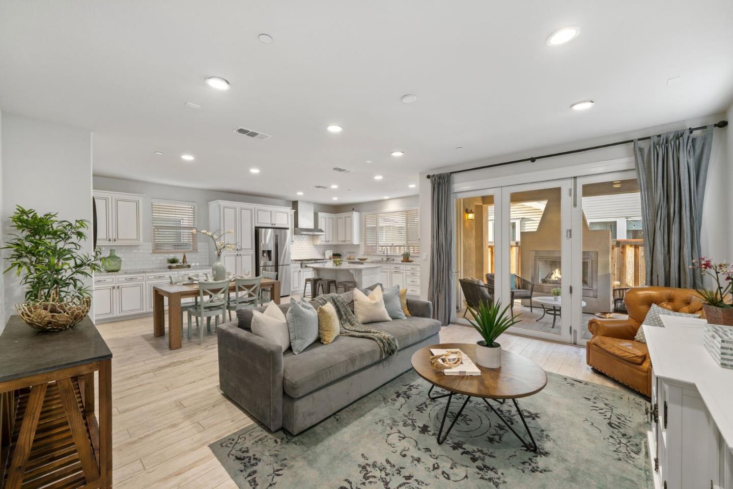 11958 Glaskin Place Dublin, CA 94568 - Photo 6 of 41 a living room with furniture potted plant and large windows