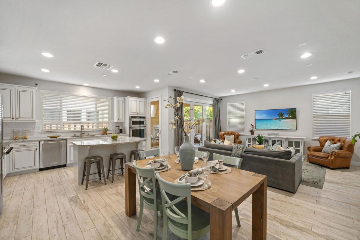 11958 Glaskin Place Dublin, CA 94568 - Photo 7 of 41 a view of a dining room with furniture kitchen and wooden floor