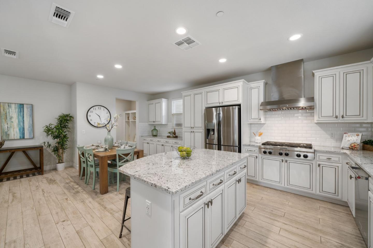 11958 Glaskin Place Dublin, CA 94568 - Photo 10 of 41 a kitchen with a stove a refrigerator and wooden cabinets