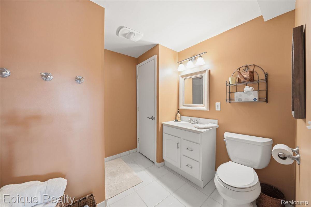 26 Kirks Court Rochester, MI 48309 - Photo 32 of 44 White tiled flooring with a baseboard trim
