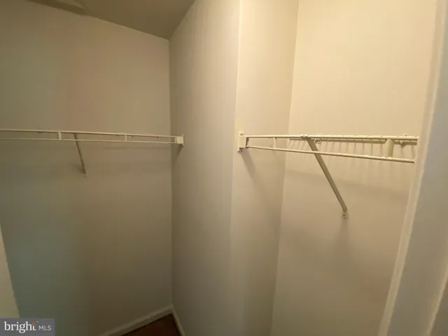 a bathroom with a sink mirror and toilet