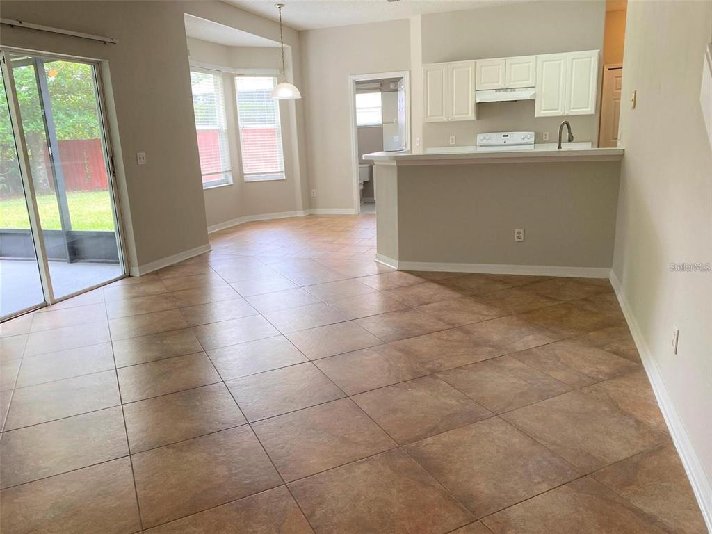 2778 Running Springs Loop Oviedo, FL 32765 - Photo 2 of 7 a view of a kitchen with an empty space and a window
