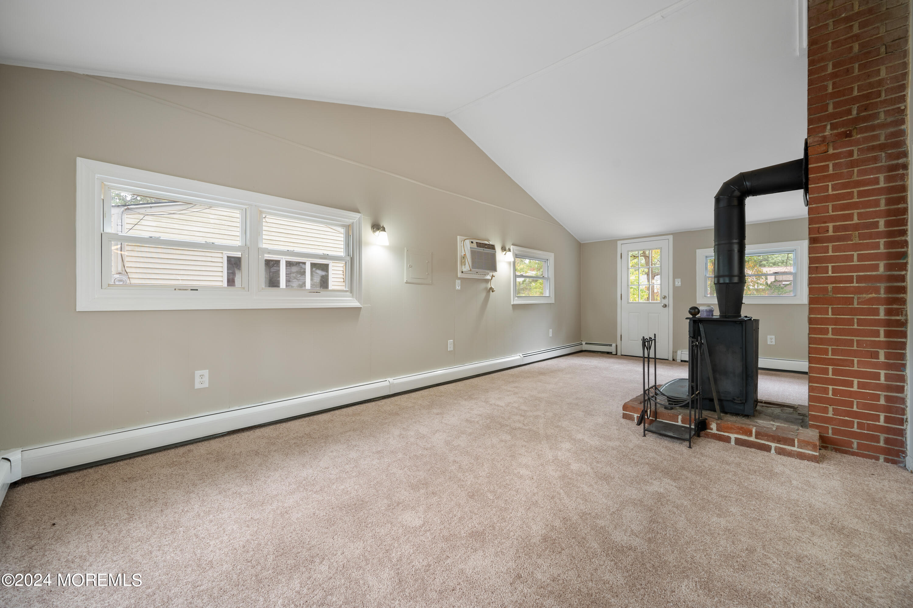 906 Tampa Road Forked River, NJ 08731 - Photo 11 of 21 a view of a room with gym equipment and windows