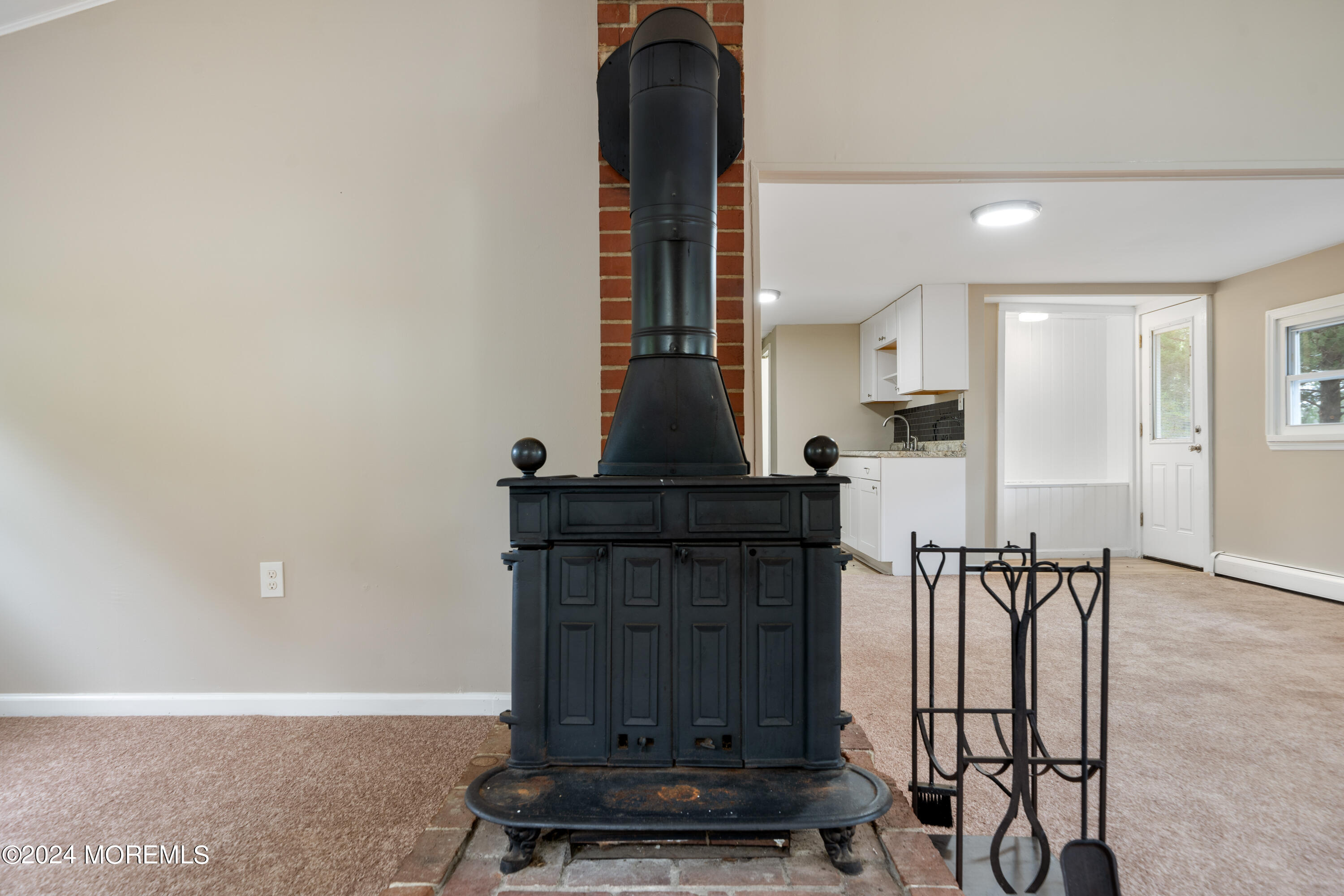 906 Tampa Road Forked River, NJ 08731 - Photo 13 of 21 a view of entryway with furniture and wooden floor