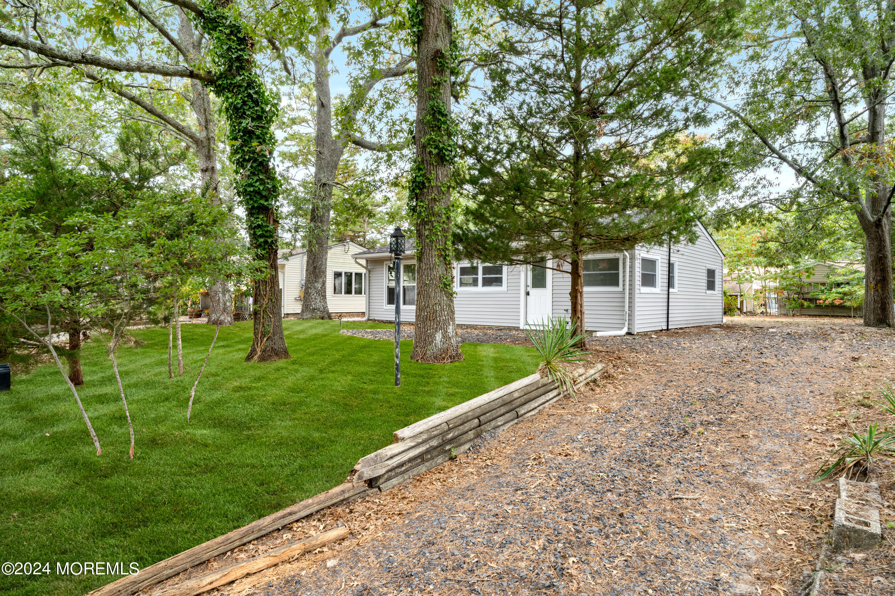 906 Tampa Road Forked River, NJ 08731 - Photo 2 of 21 a view of a house with backyard and a tree