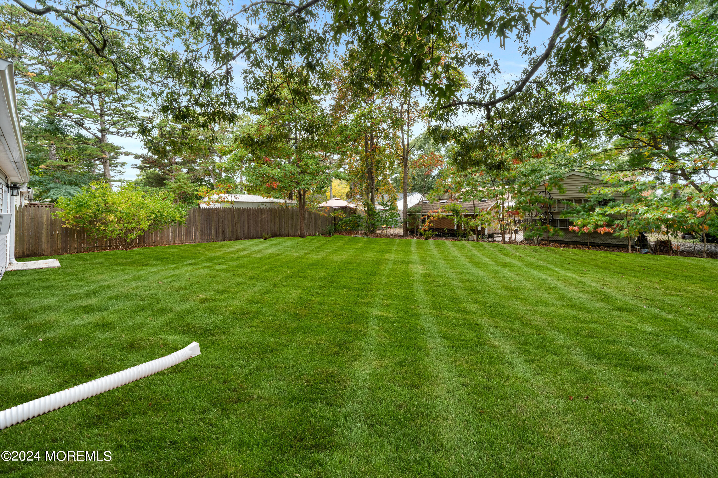 906 Tampa Road Forked River, NJ 08731 - Photo 21 of 21 a view of a field with large trees