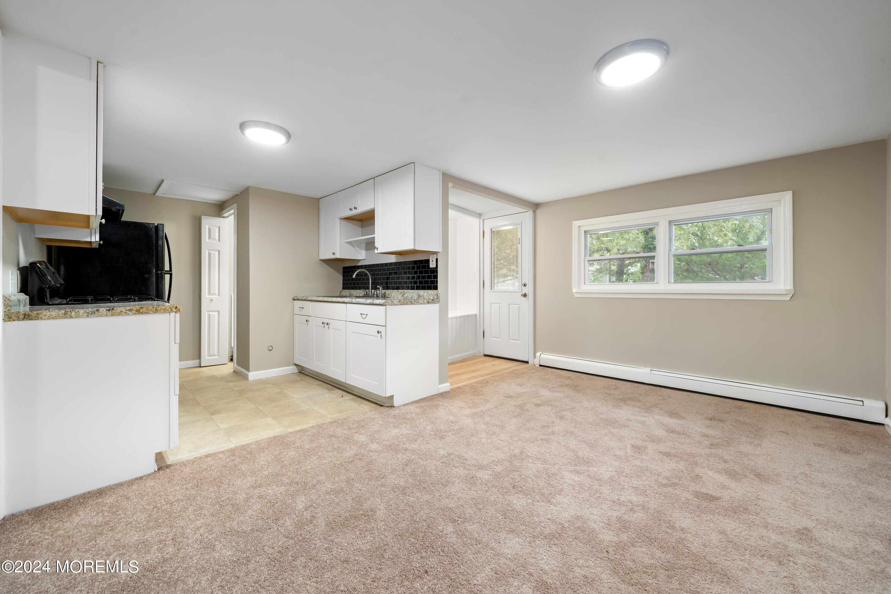 906 Tampa Road Forked River, NJ 08731 - Photo 5 of 21 a view of a kitchen with microwave and cabinets