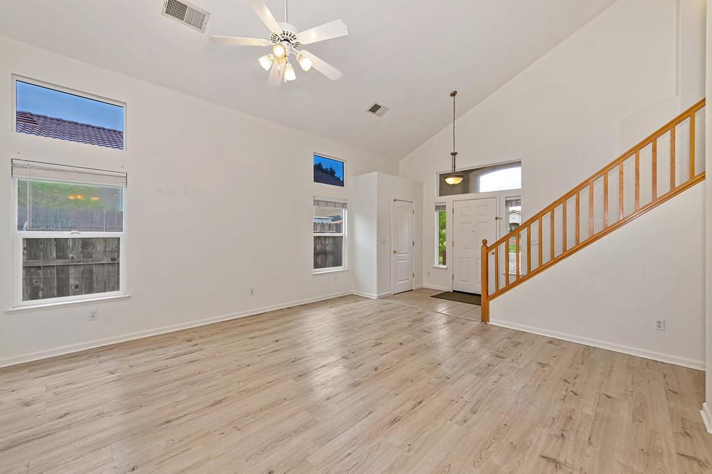 3524 Riojo Way Rancho Cordova, CA 95670 - Photo 8 of 47 a view of an empty room with wooden floor and a window