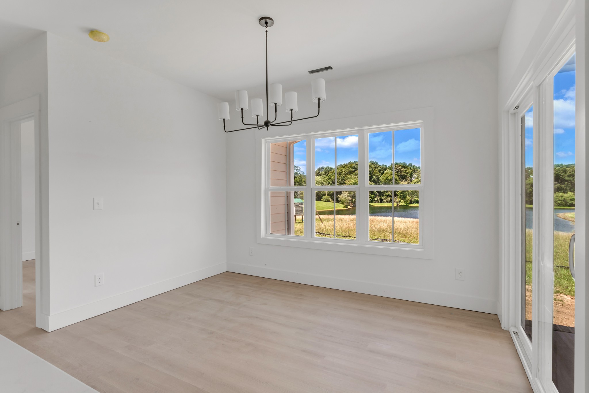 1171 Abiff Road Bon Aqua, TN 37025 - Photo 11 of 45 a view of an empty room with a window