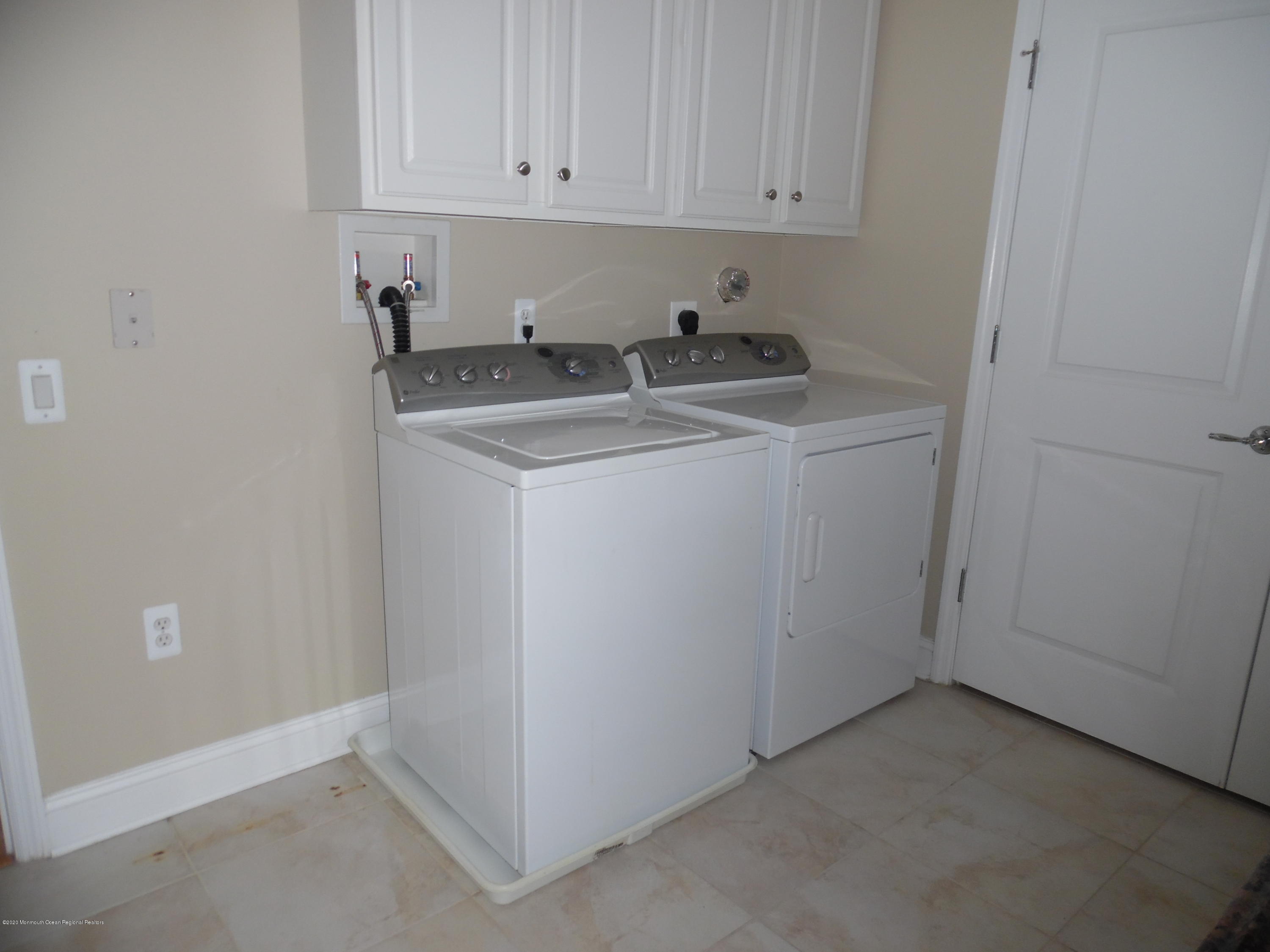 2201 River Road, Unit 2203 Point Pleasant, NJ 08742 - Photo 8 of 23 a utility room with a sink