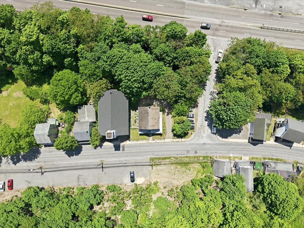 167 Main Road Lehighton, PA 18235 - Photo 39 of 41 An aerial perspective reveals a collection of houses nestled amidst lush greenery, adjacent to a thoroughfare.